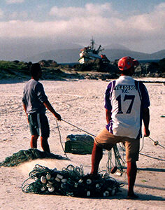 Pescadores e barco